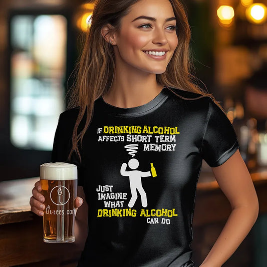 Woman holding a beer in a bar wearing a black tee shirt with a cartoon character and humorous text saying 'If drinking alcohol affects short term memory just imagine what drinking alcohol can do'
