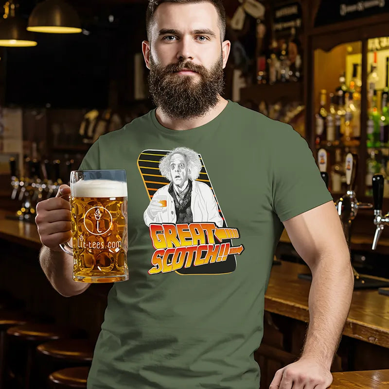 Man in a bar wearing a t-shirt with a graphic design and holding a beer mug.