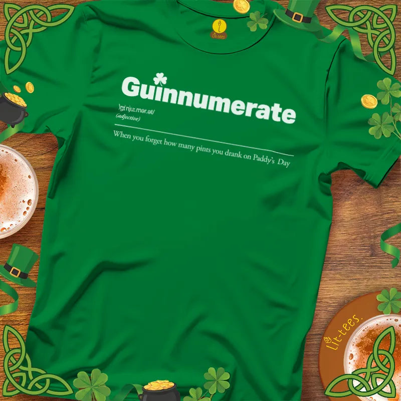 Green t-shirt with 'Guinnumerate' text on a wooden surface with St. Patrick's Day decorations.