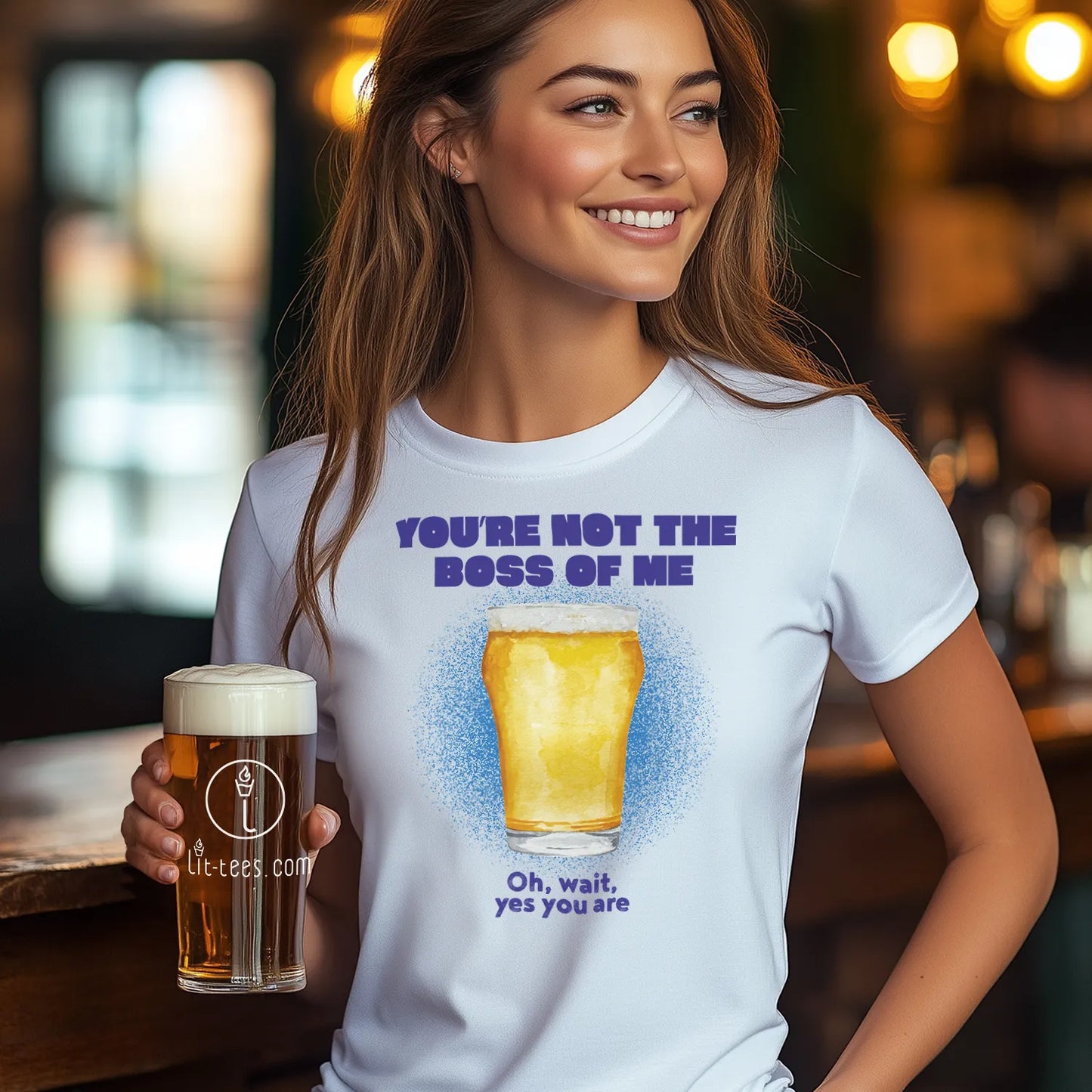 Woman wearing a white t-shirt saying 'You're not the boss of me' holding a beer glass.