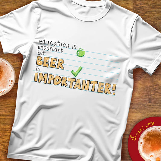 White tee shirt saying in typographical style saying 'Education is important but beer is importanter' lay flat with beer glasses
