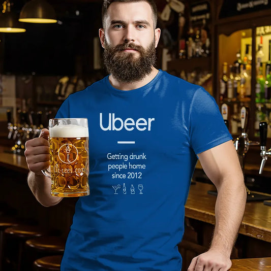 Man in a bar wearing a blue t-shirt with 'Ubeer' branding, holding a beer.